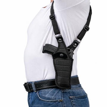 Black tactical vertical shoulder holster worn under the arm with adjustable straps and snap retention