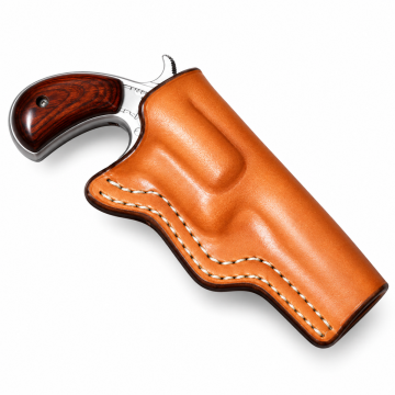 Handmade saddle tan wet-molded leather holster with compact revolver, side profile