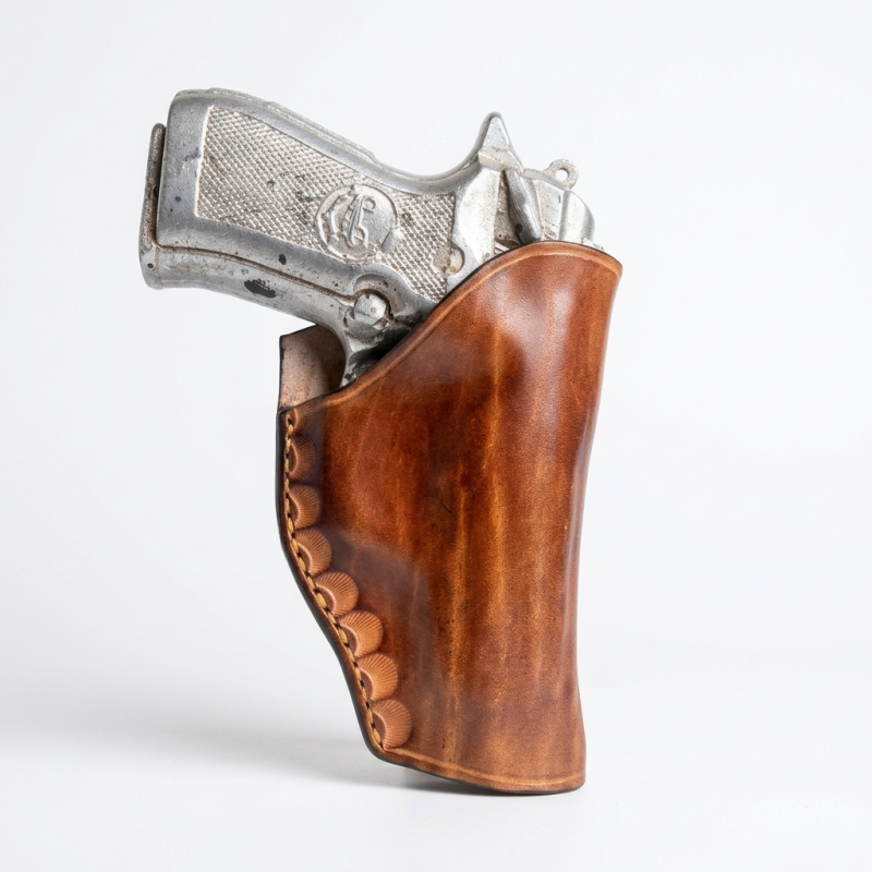 Beretta 84FS Cheetah brown leather holster with decorative stitching on white background