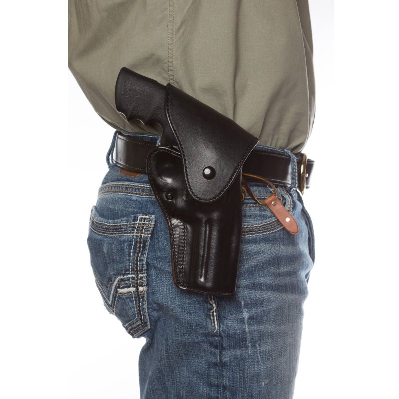 Black leather OWB hip holster worn on belt for strong-side carry