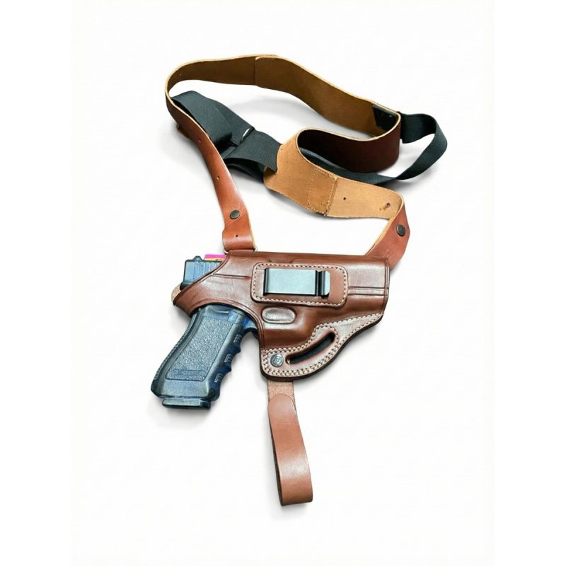 Brown leather shoulder holster system with adjustable straps and belt support, shown on white background