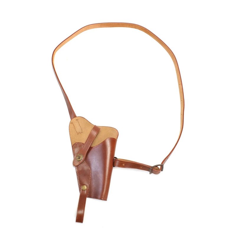 Brown leather shoulder holster laid flat showing strap and tie-down configuration