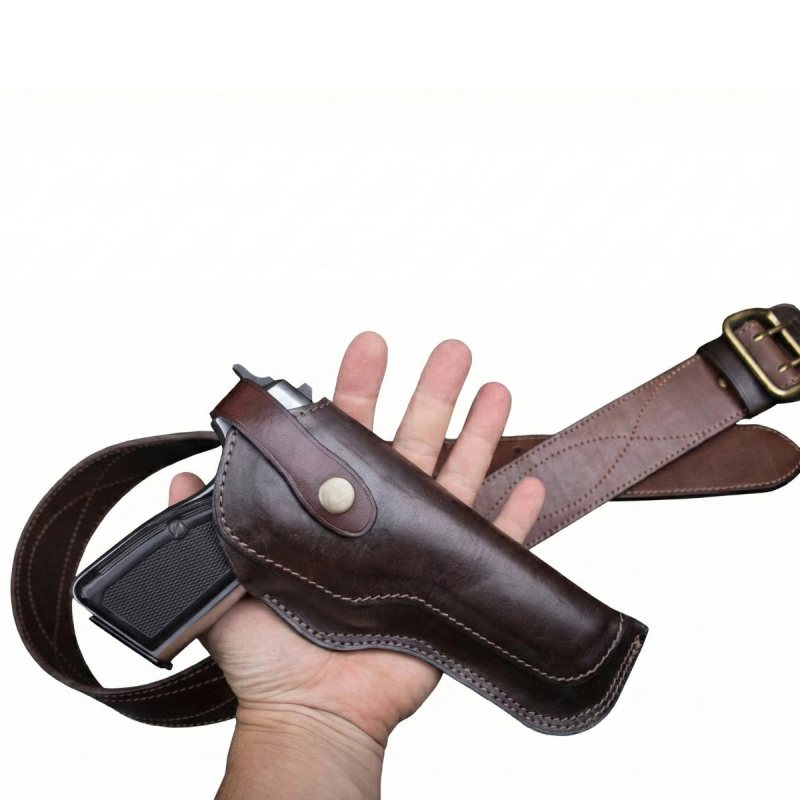 Vintage brown leather OWB belt holster with classic stitched design shown with matching leather belt