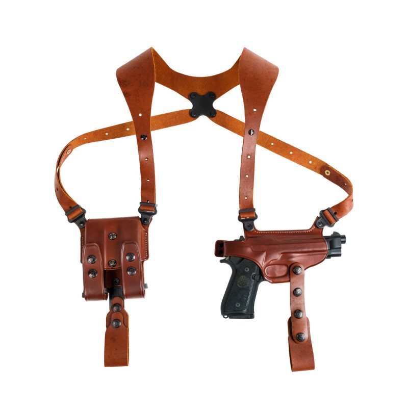Classic leather shoulder holster system laid flat showing full harness and accessory layout