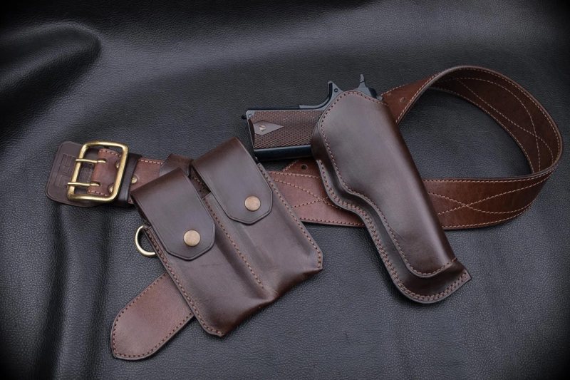 double magazine pouch on black leather surface