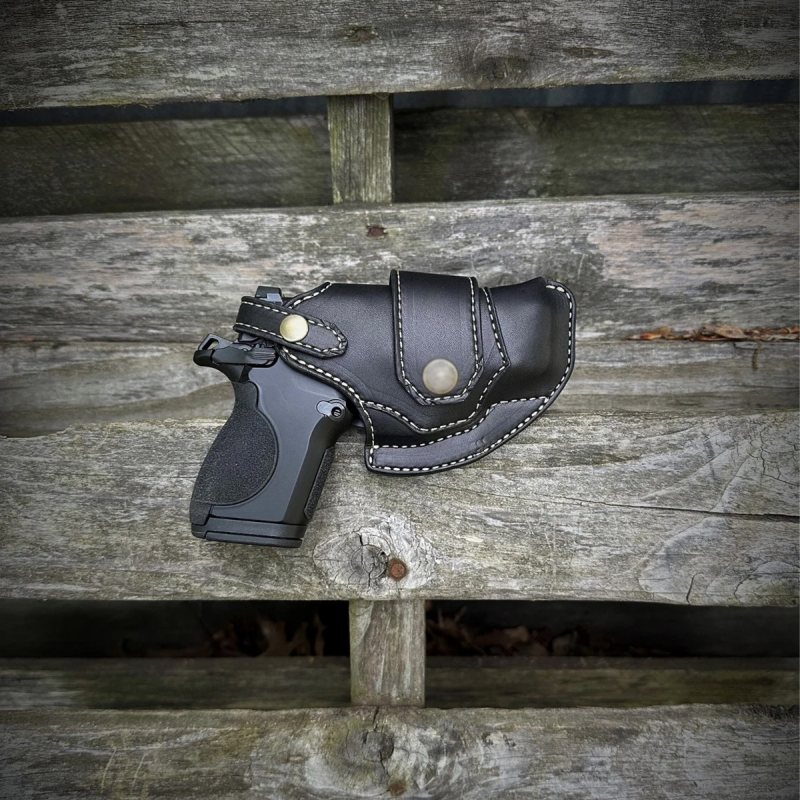 Black leather holster with horizontal draw side view
