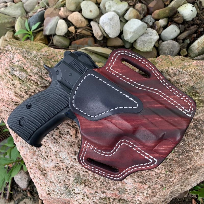 Mahogany woodgrain finish OWB leather belt holster showing molded profile and contrast stitching